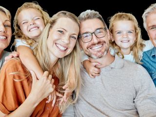 Smiling multi-generation family — patients of Smile Makers of Georgia in Alpharetta