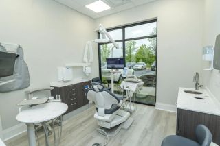 A treatment room at Smile Makers of Georgia in Alpharetta, with a window onto the courtyard